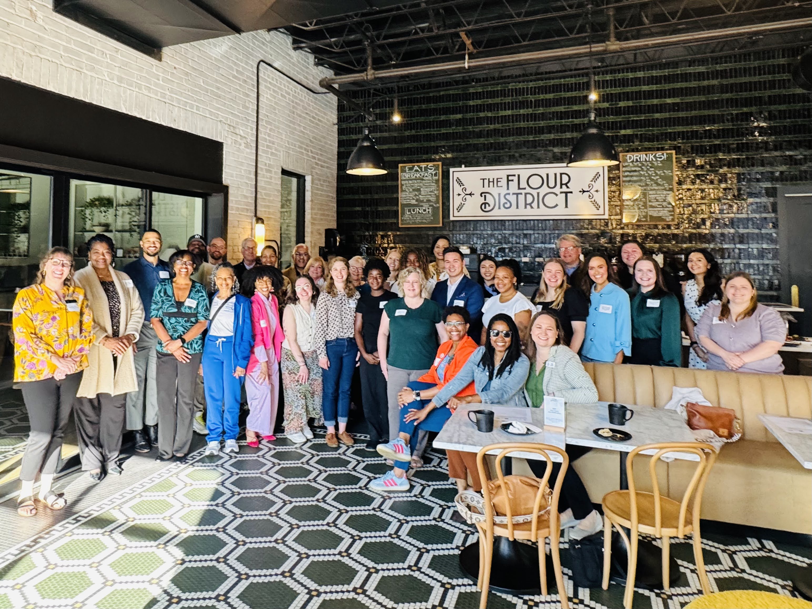 mentors, mentees and advisors at kickoff coffee at the Flour District